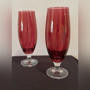Two cranberry, incandescent 8.5” tall glasses.